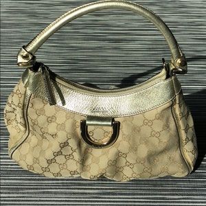 Authentic Gucci "GG" canvas D Gold hobo handbag